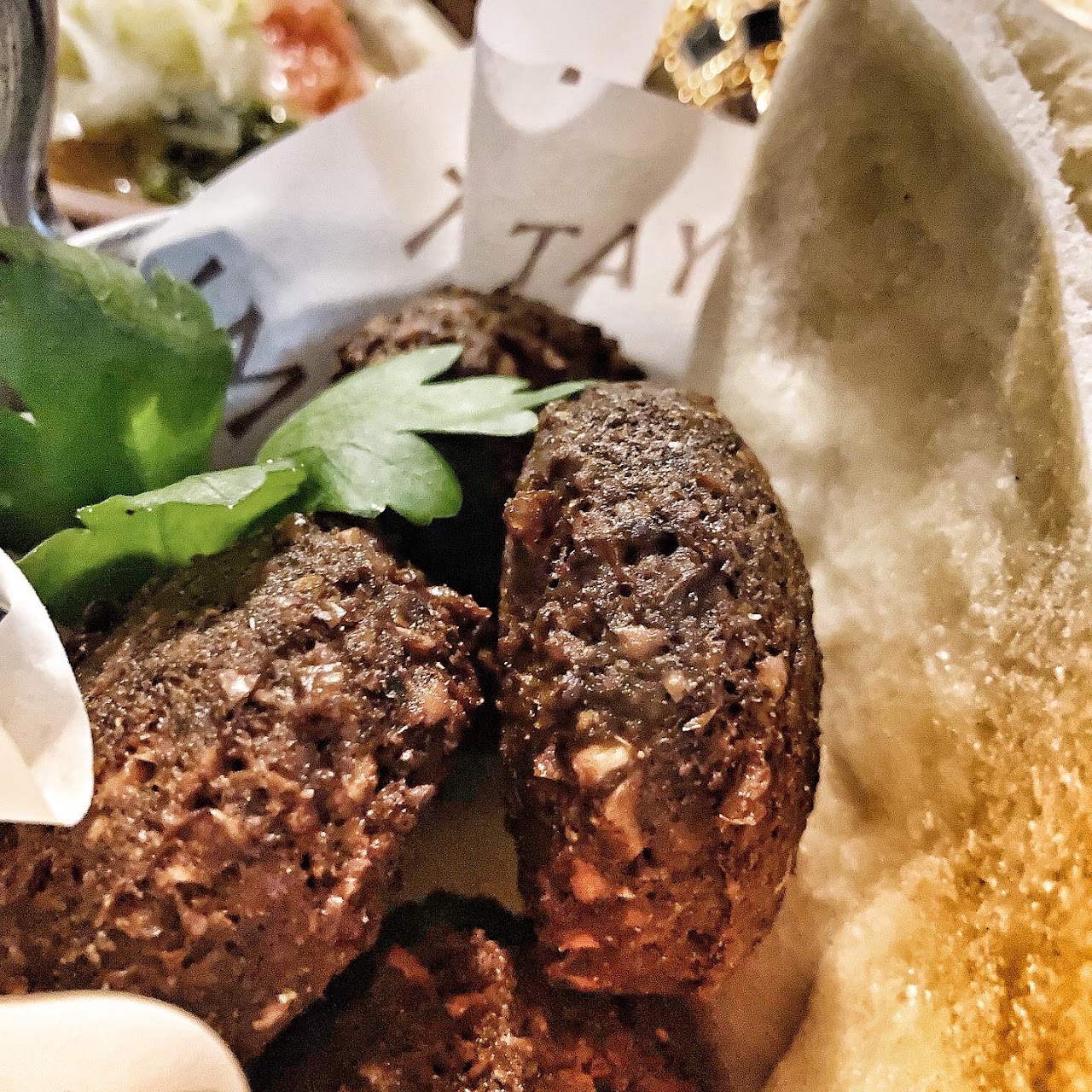 Kofta and flatbread served at Tayim